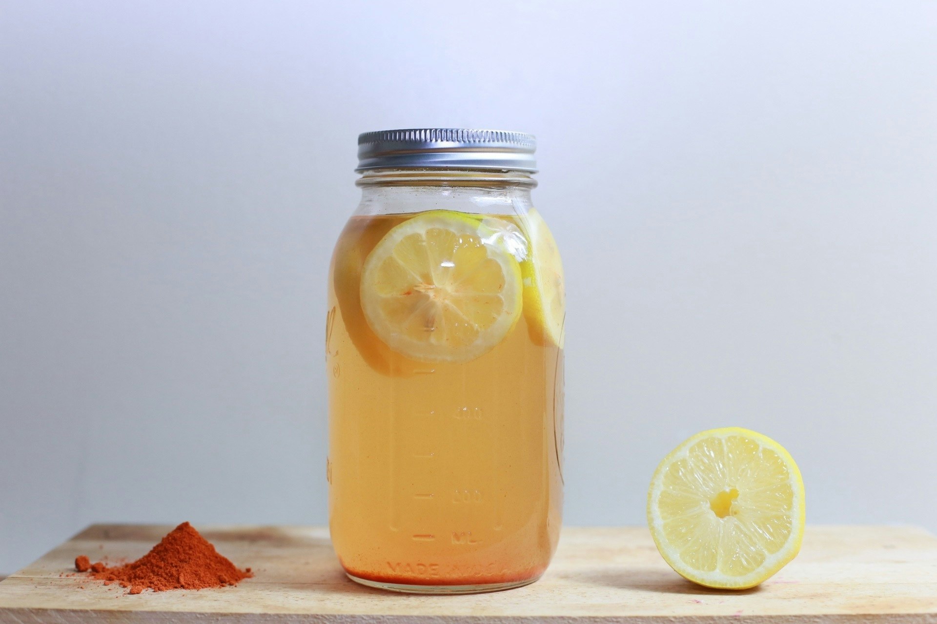 clear glass mason jar on brown surface